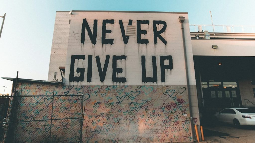 a building with graffiti written on the side of it