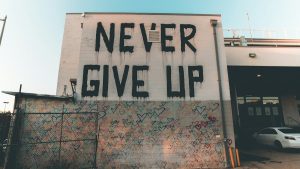 a building with graffiti written on the side of it